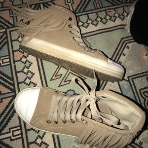 Fringe high top sneakers.